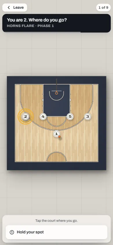 A quiz question on a phone: “You are 1. Where do you go?” over the court.